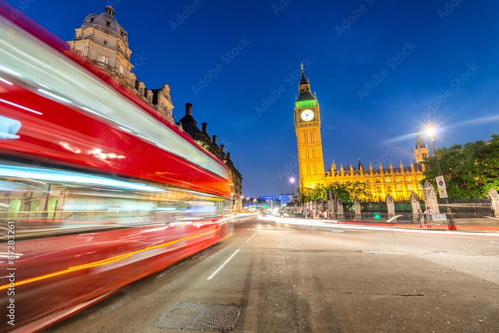 Moving Double Decker Bus under Houses of Parliament and Big Ben.