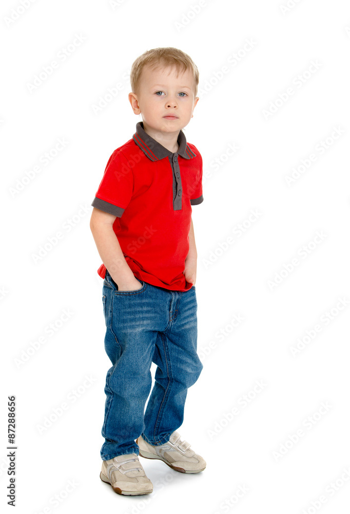 Cheerful little boy in the red sweater and jeans standing Cheerful little boy in the red sweater and jeans standing