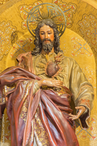 GRANADA, SPAIN - MAY 29, 2015: The the carved statue of The Heard of Jesus in church Nuestra Senora de las Angustias by Josr de Mora (17. cent.).
