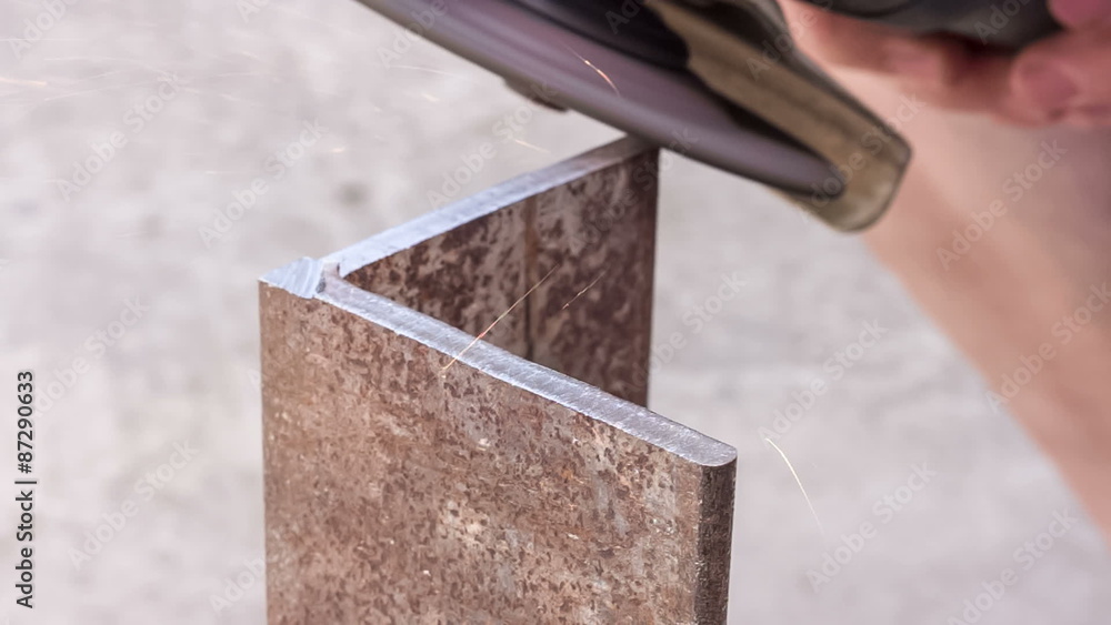 Processing sharp edges on the metallic article with a grinding wheel Processing sharp edges on the metallic article with a grinding wheel