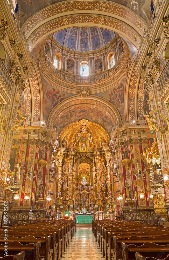 GRANADA, SPAIN - MAY 29, 2015: The nave of  baroque Basilica San Juan de Dios with the frescoes by Diego Sanchez Sarabia from second part of 18. cent.