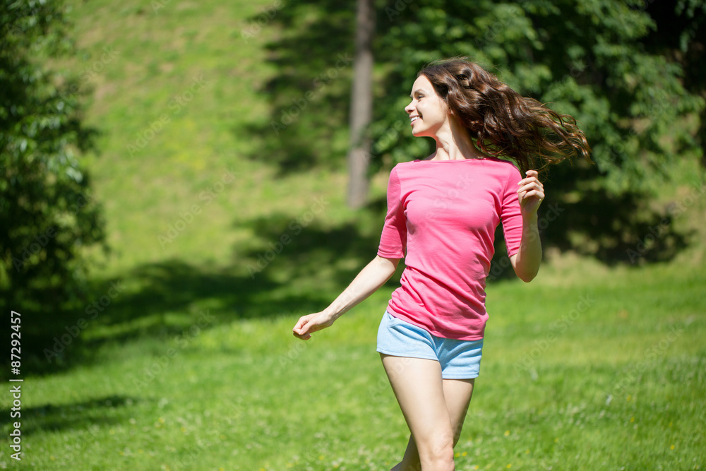 Young beautiful woman running in the park Young beautiful woman running in the park