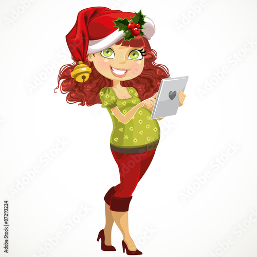 Young pregnant woman with tablet computer in Santa suit