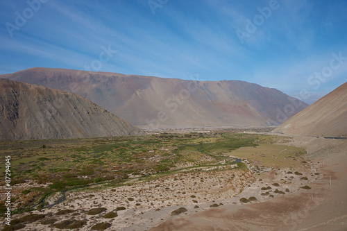 Pan American Highway (Route 5) running south to north for over 3000 km through Chile as it passes through the valley of the Rio Camarones in the Atacama Desert close to Arica in northern Chile.