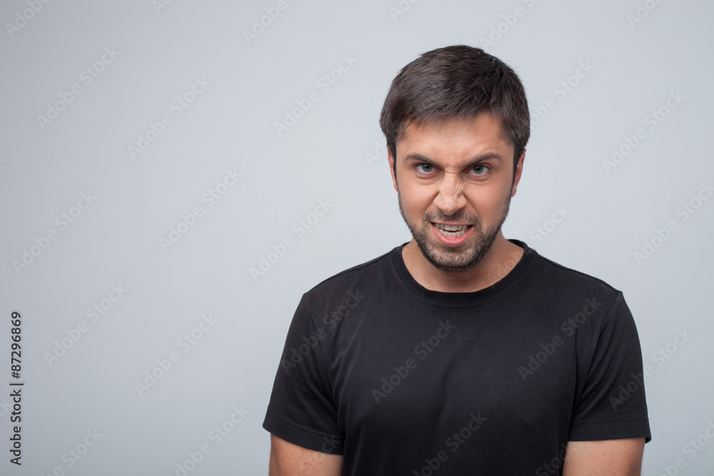 © Yakobchuk Olena - Young aggressive man is evincing his frustration