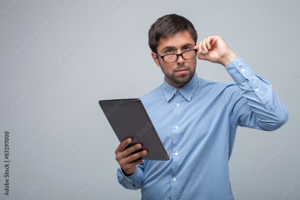 Handsome young man is working with laptop Handsome young man is working with laptop