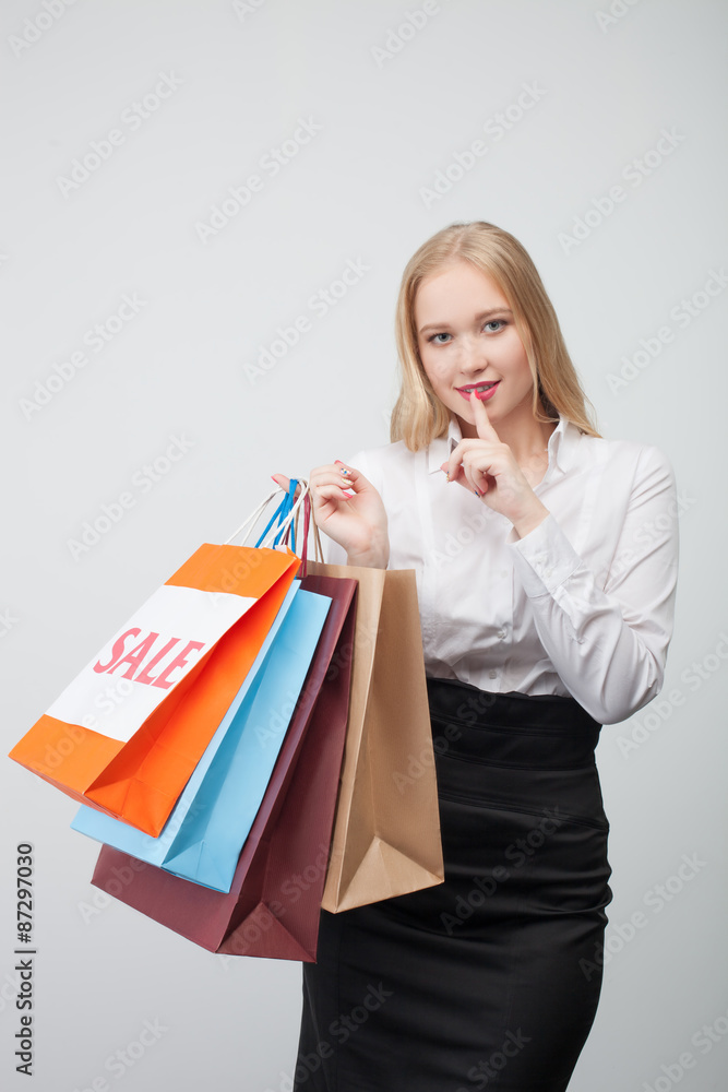 Pretty young woman is going shopping secretly