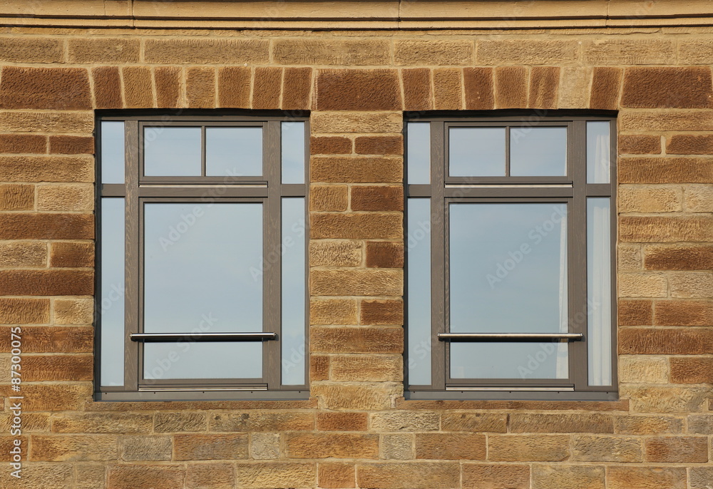 Obraz premium Facade made from freestones with two common modern windows