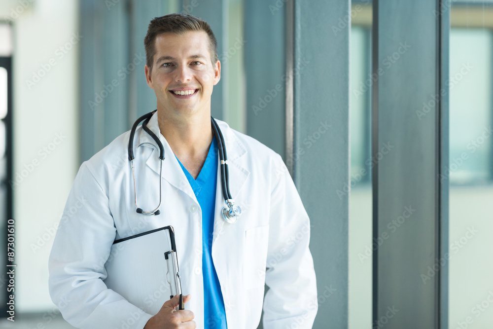 young doctor holding a clipboard young doctor holding a clipboard