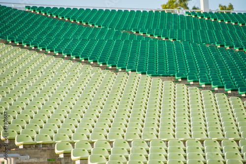 Rows of symmetrical seats in a stadium © superjoseph