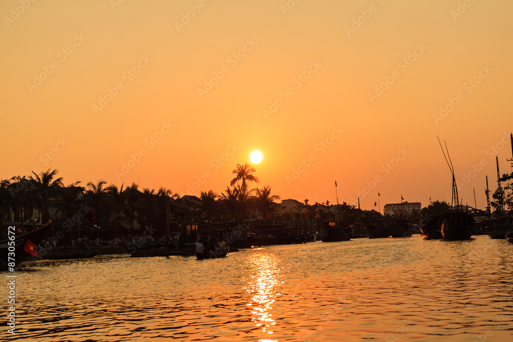 Fototapeta premium Sunset on river at Hoi An old town, Vietnam