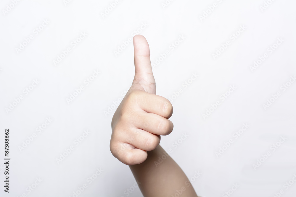 Girl raising one fingers up on hand that is thumb up its shows superb or excellent symbol on white background.
Girl raising one fingers up on hand that is thumb up its shows superb or excellent symbol on white background.