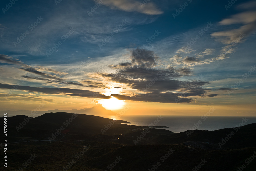 Greek coast of aegean sea at sunrise near holy mountain Athos