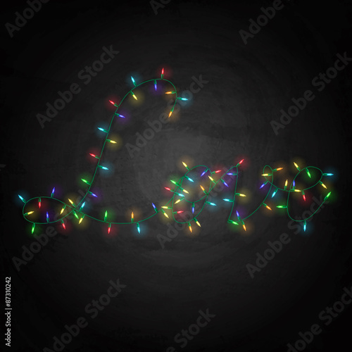 Colorful lights with word Love on blackboard background