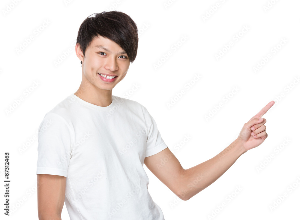Asian young man with finger point up Asian young man with finger point up