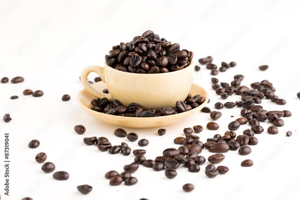 Cup full of coffee beans on on white background Cup full of coffee beans on on white background
