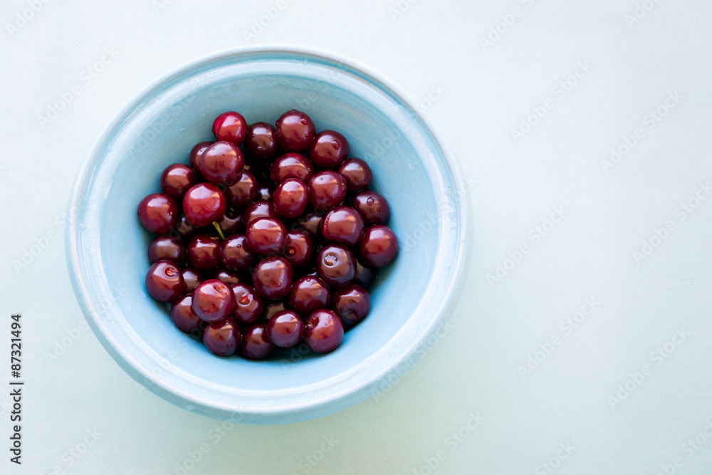 Fresh cherries in bowl on table Fresh cherries in bowl on table