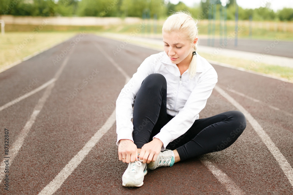 Athletic woman jogging in the evening. Athletic woman jogging in the evening.