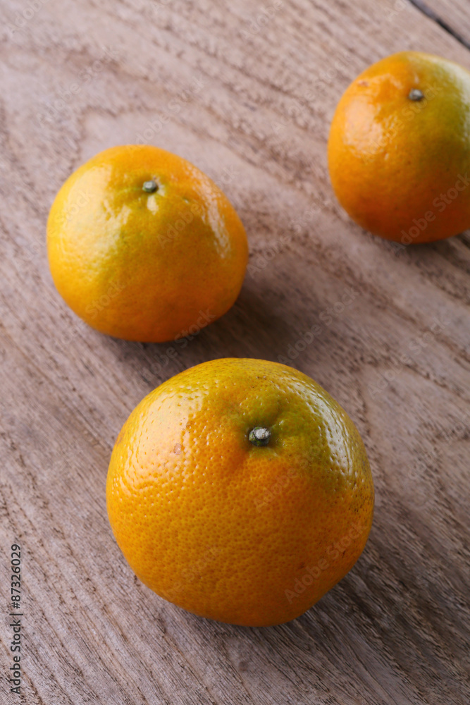 oranges fruit on brown wood table oranges fruit on brown wood table