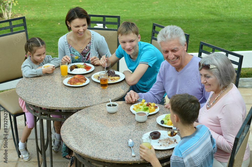 Family at breakfast on resort Family at breakfast on resort