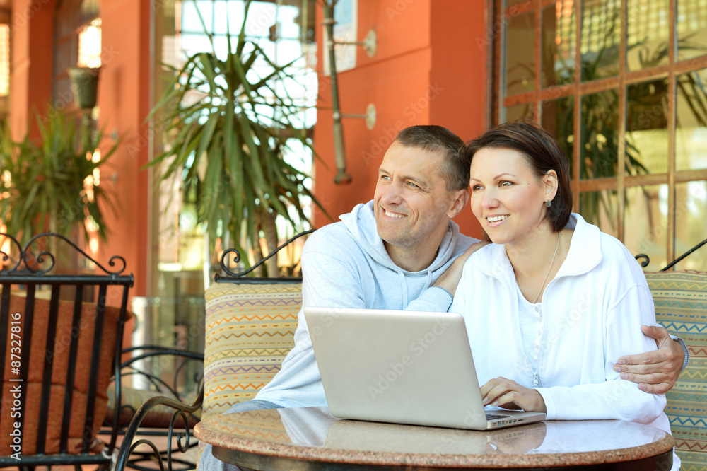 Happy couple with laptop Happy couple with laptop
