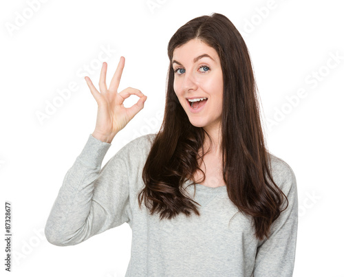 Young woman with ok sign gesture