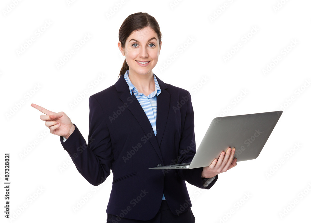 Businesswoman use of the laptop computer and finger point up Businesswoman use of the laptop computer and finger point up