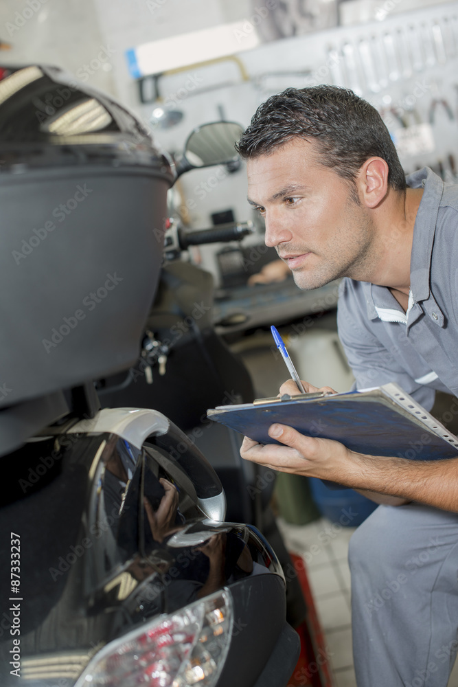 Mechanic testing a car