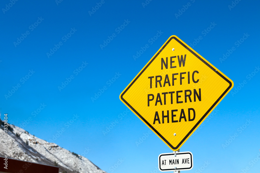 New Traffic Pattern Ahead yellow diamond street sign