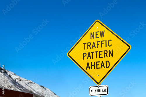 New Traffic Pattern Ahead yellow diamond street sign