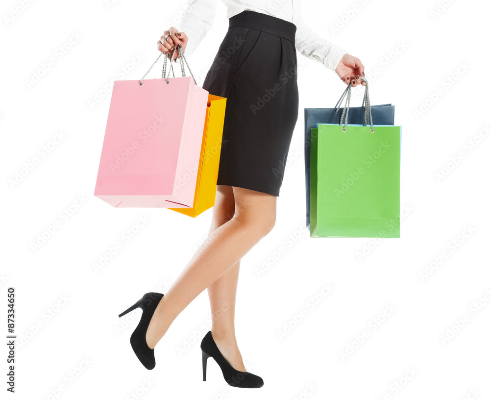 Woman legs with colorful packages