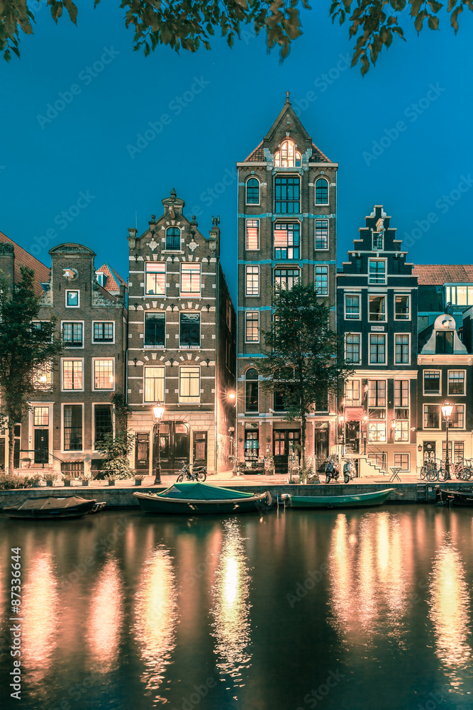 Night Amsterdam canal with dutch houses