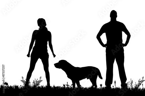 Vector silhouette of a couple with a dog.