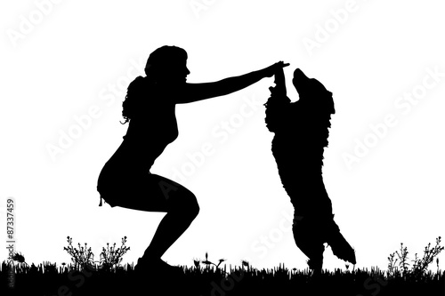 Vector silhouette of a woman with a dog.