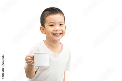 boy drinking orange juice and hold white plastic cup