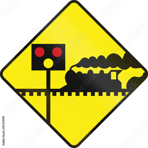 Fotografie Warning road sign in Ireland - Level crossing with signals ahead