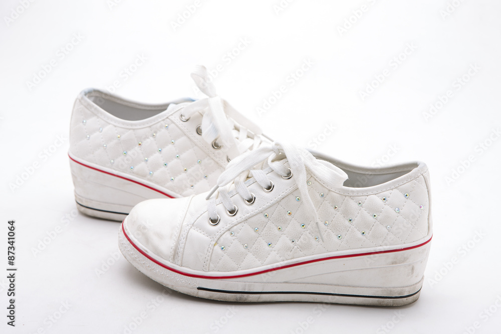 Pair of new white sneakers on white background Pair of new white sneakers on white background