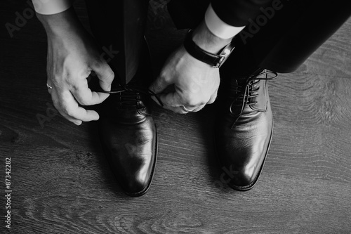 Business man dressing up with classic  elegant shoes. Groom