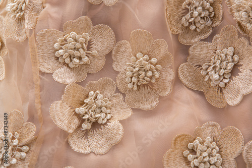 Pink fabric flower isolated on a white background.