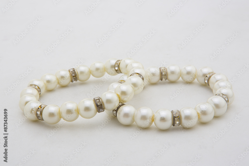 Pearl bracelet of white on a white background Pearl bracelet of white on a white background