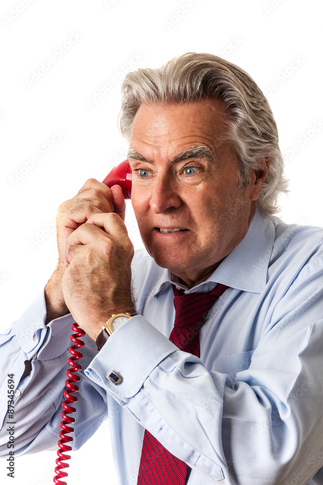 Businessman Gripping Red Phone
Photo of a mature Caucasian man with gray hair, wearing a shirt and tie and looking concerned, holding a classic red telephone Businessman Gripping Red Phone
Photo of a mature Caucasian man with gray hair, wearing a shirt and tie and looking concerned, holding a classic red telephone