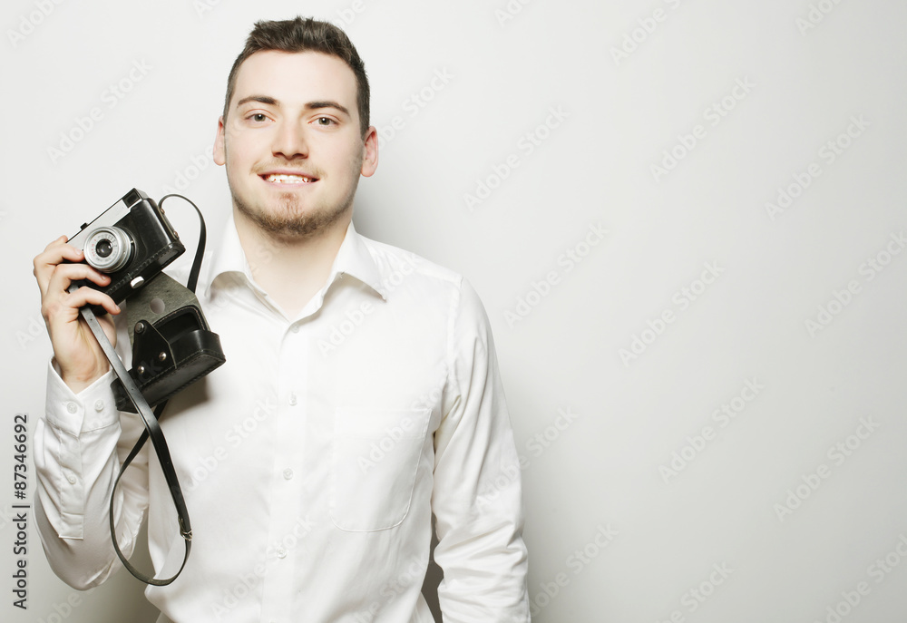 Obraz premium young photographer over white background