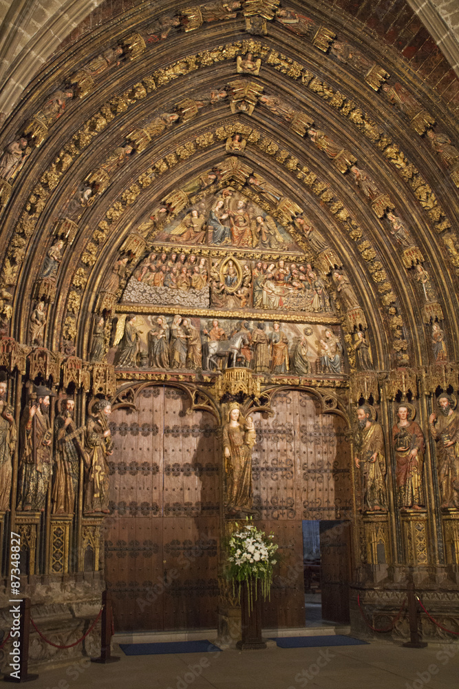 Wood carved polychrome portal from the 14th century in the Church of Santa Maria de los Reyes(Saint Mary of the Kings).Laguardia,Spain Wood carved polychrome portal from the 14th century in the Church of Santa Maria de los Reyes(Saint Mary of the Kings).Laguardia,Spain