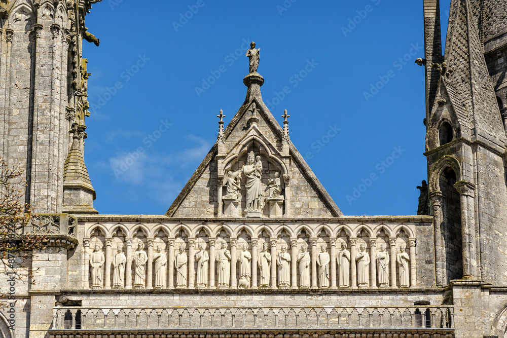 Group of sculptures above Royal Portal of Cathedral Our Lady of