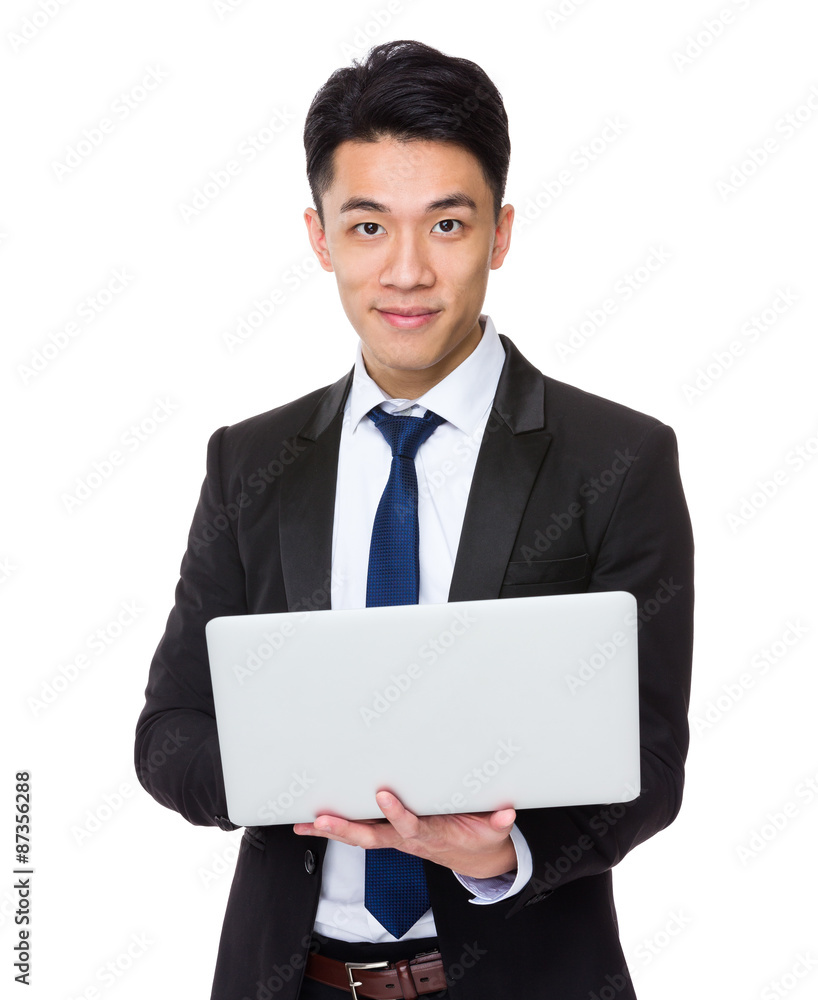 Young businessman use of the laptop computer Young businessman use of the laptop computer