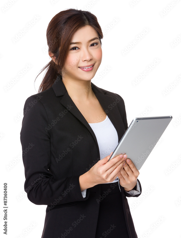 Asian Young businesswoman use of the tablet pc Asian Young businesswoman use of the tablet pc