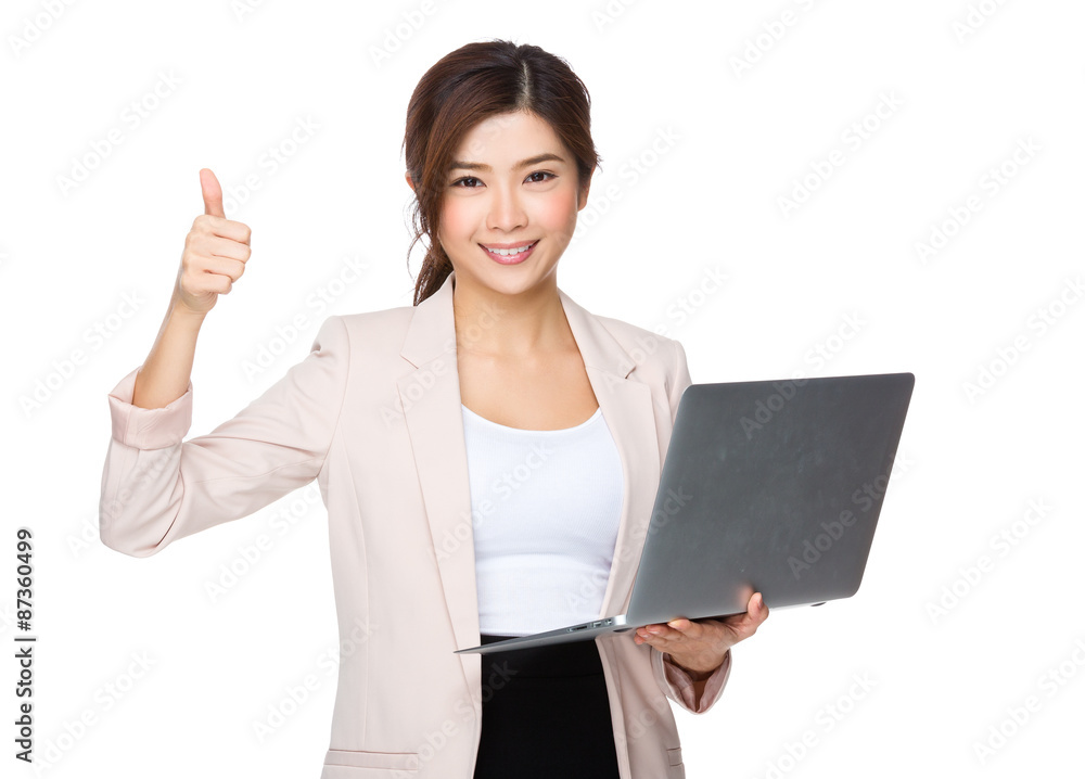Asian young businesswoman hold with notebook computer and thumb Asian young businesswoman hold with notebook computer and thumb