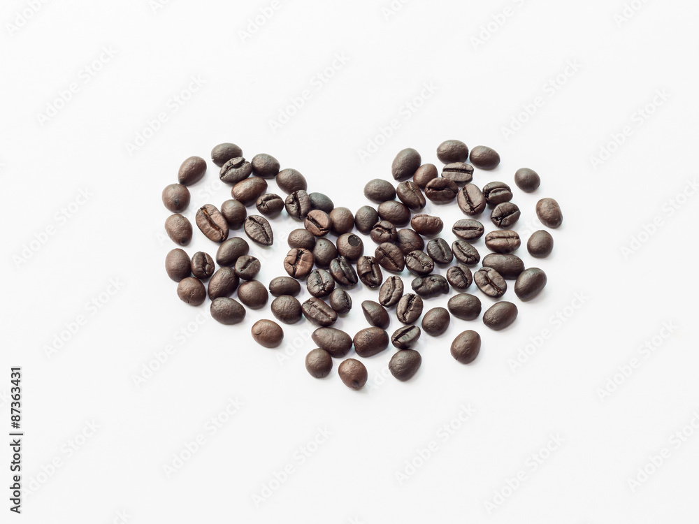 Heart from coffee beans isolated on white background. Heart from coffee beans isolated on white background.