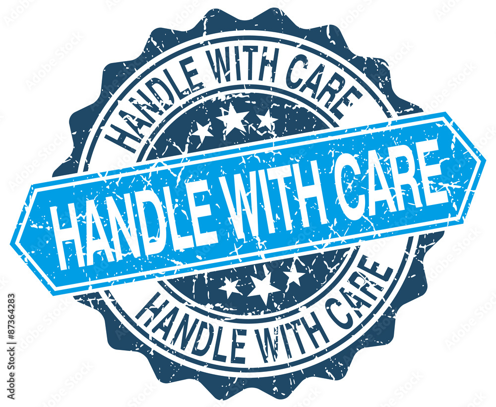 Fototapeta premium handle with care blue round grunge stamp on white