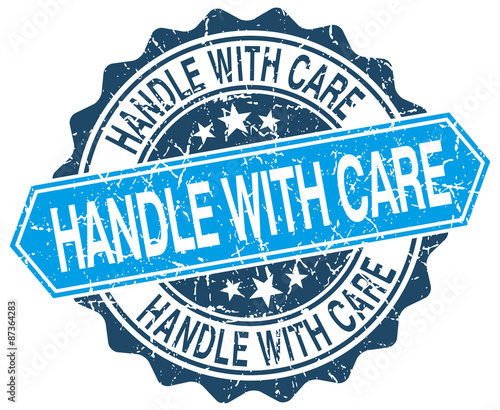 handle with care blue round grunge stamp on white